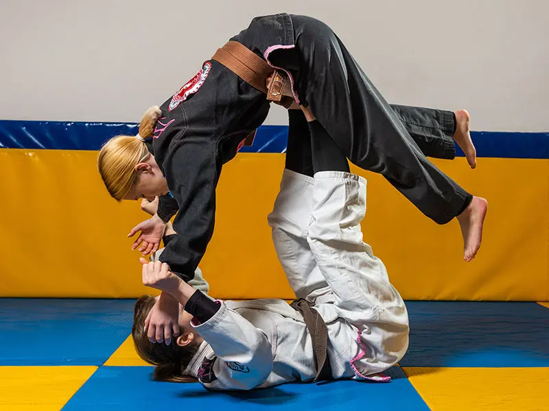 Women's jiu-jitsu class partner drilling at Rising Tide Hi Tech in Hanover MD