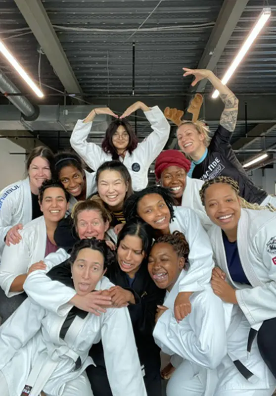 Adults drilling Brazilian jiu-jitsu techniques in gi at Rising Tide Hi Tech