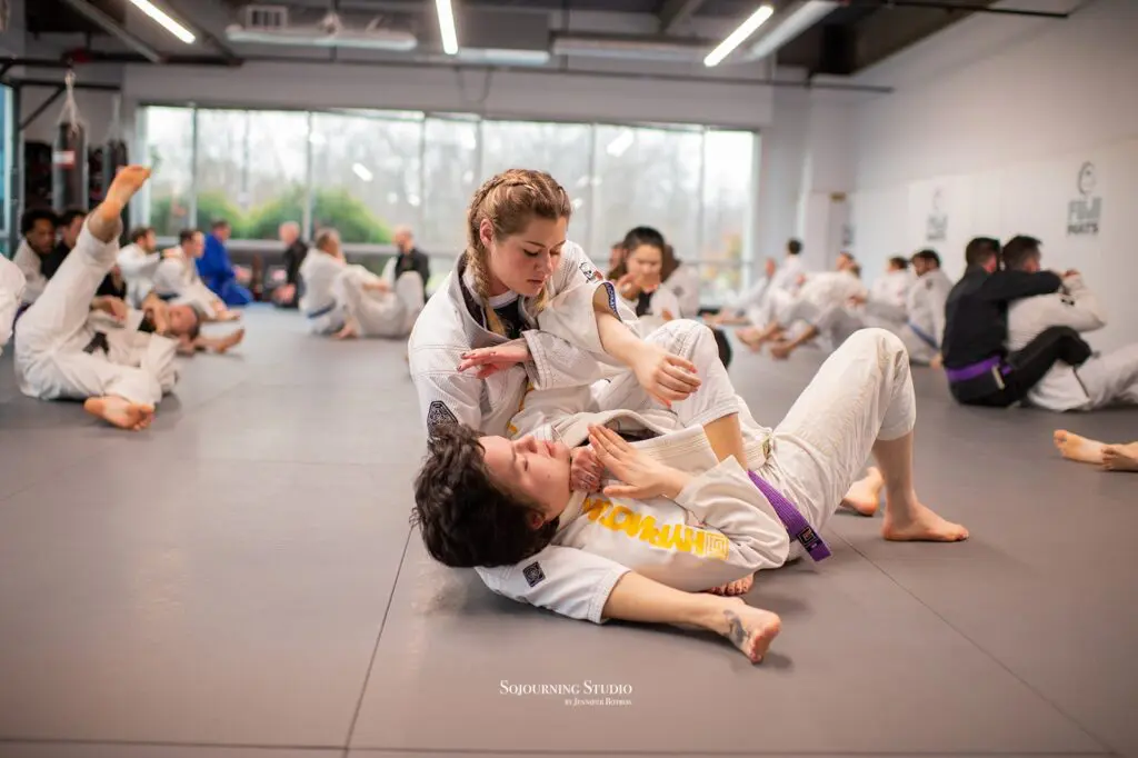 Toney Waldecker teaching BJJ back attack technique at Rising Tide Hi Tech seminar
